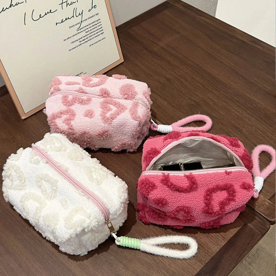 Trousse maquillage - Élégance Nori - blanc et rose claire - fermées - rose foncé ouverte - posées sur table - rangement innovant