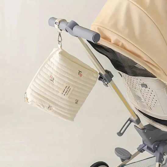 Trousse de toilette bébé - Complète et Pratique - rangement innovant - tulipes - accrochée à la poussette