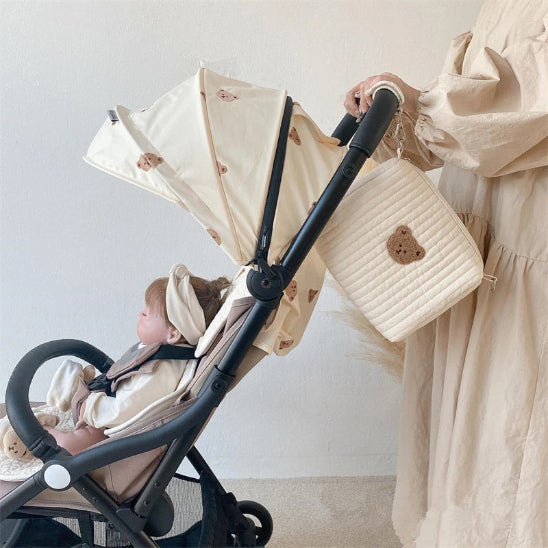 Trousse de toilette bébé - Complète et Pratique - rangement innovant - accrochée à la poussette