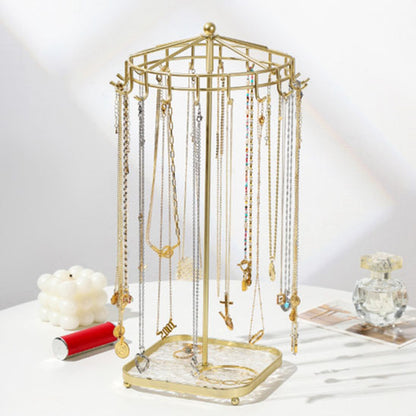 Bijoux-rangement-support-rotatif-rangement-innovant-doré-posé-sur-une-table-moderne-blanche