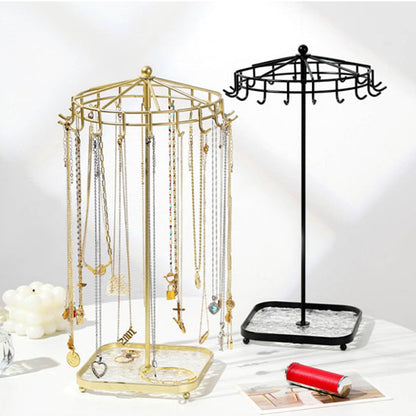 Bijoux-rangement-support-rotatif-rangement-innovant-noir-et-doré-posés-sur-une-table-moderne-blanche