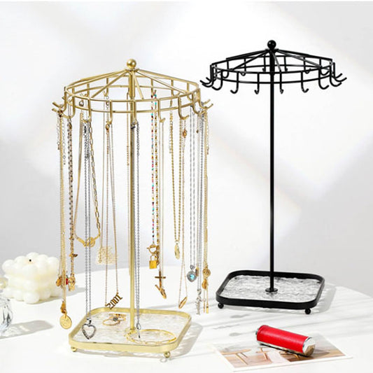 Bijoux-rangement-support-rotatif-rangement-innovant-noir-et-doré-posés-sur-une-table-moderne-blanche