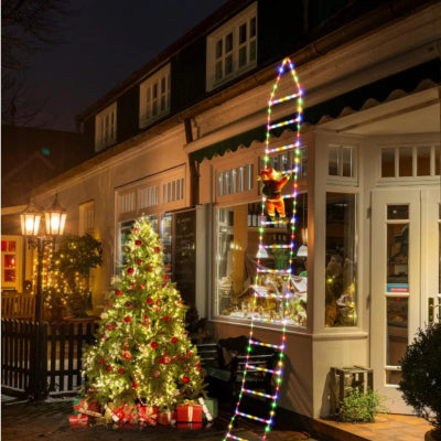 Décoration noël extérieur Féerique lumière multicolore père noël escalader le toit maison