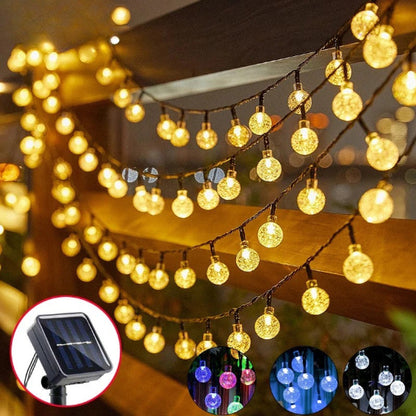 Guirlande solaire Luminéco  lumière chaude allumée décoration barrière jardin 