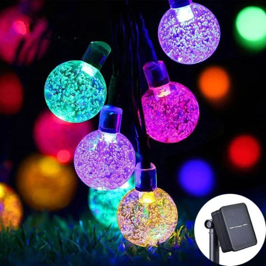 Guirlande solaire Luminéco lumière multicolore allumée décoration jardin 