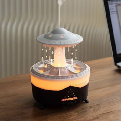Humidificateur d air  OVNI noir posé sur bureau