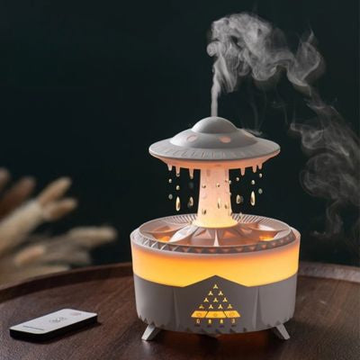 Humidificateur d air  OVNI blanc posé sur plateau rond en bois sombre
