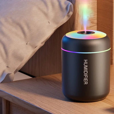 Humidificateur d'air  Pur et Sain noir sur table de chevet
