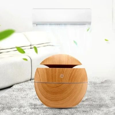 Humidificateur d air​ marron clair posé sur tapis