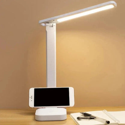 Lampe de bureau  LumiWork avec smartphone posé sur son pied