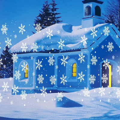 PROJECTEUR LED EXTERIEUR Flocons Féériques posé sur la neige projection flocons neige sur façade église ciel bleu