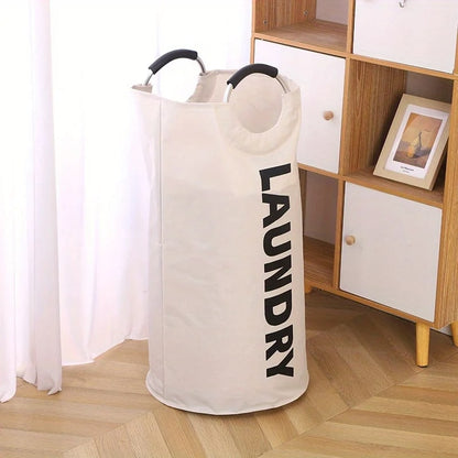 Panier-à-linge-pliable-spacieux-rangement-innovant-blanc-posé-dans-le-salon