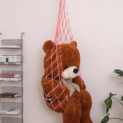 Rangement peluches Suspendu Bohème rose portant ours brun suspendu côté étagère