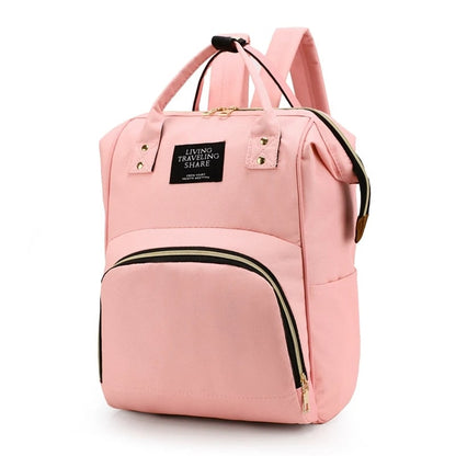 Sac-à-dos-à-langer-nori-rangement-innovant-rose-clair