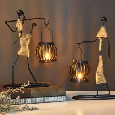 Bougeoir design plusieurs modèles bougies allumées projection ombre sur mur