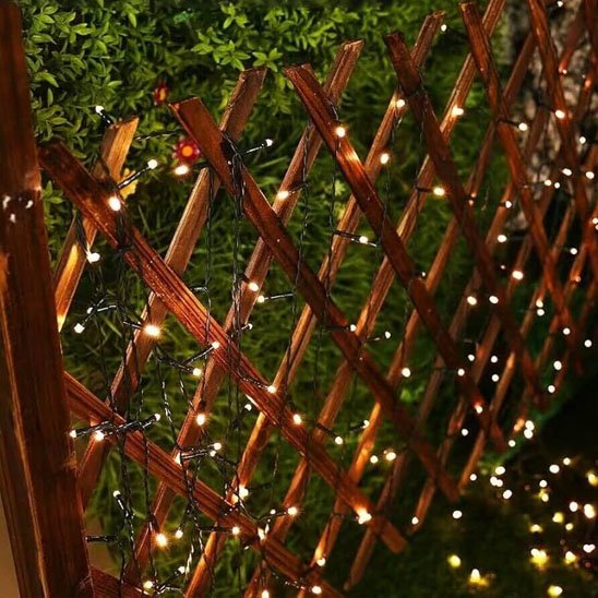 Guirlande solaire  Écomagic allumée lumière chaude décoration barrière jardin 
