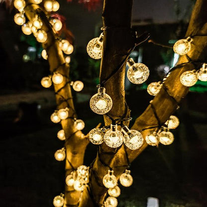 Guirlande solaire Luminéco lumière chaude allumée décoration arbre jardin