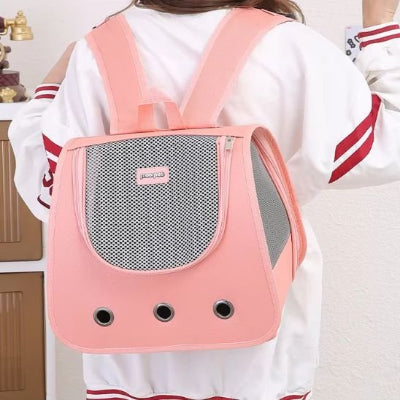 sac a dos chat rose porté au dos par jeune fille